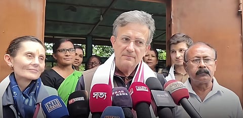 Image of the French Ambassador Thierry Mathou conversing with the media personnel
