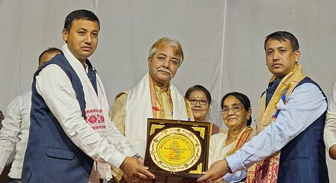 Image of Veteran Assamese Actor Pranjal Saikia while receiving the award