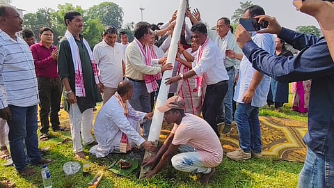 Images show the ceremonial flag post of the Karmapran Khirod Barua Memorial All Assam One-Act Play Competition being raised at Morigaon School Field