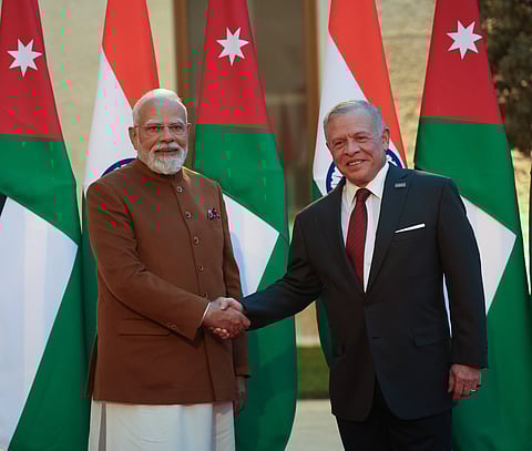 Image of Indian Prime Minister Narendra Modi on the left and King Abdullah II of Jordan on the right