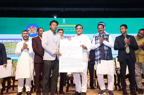 Image shows the Assam CM distributing appointment letters to the 215 candidates from the tea garden community in various technical & non-technical roles under the Health Dept.