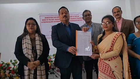 Image of the Biswanath District Administration handing over posting orders to newly appointed teachers for high schools and higher secondary schools in the district.