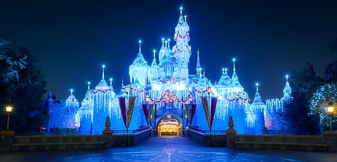 Artisans craft a 100-foot fairy-tale castle with 3D lighting for the mega festive spectacle.