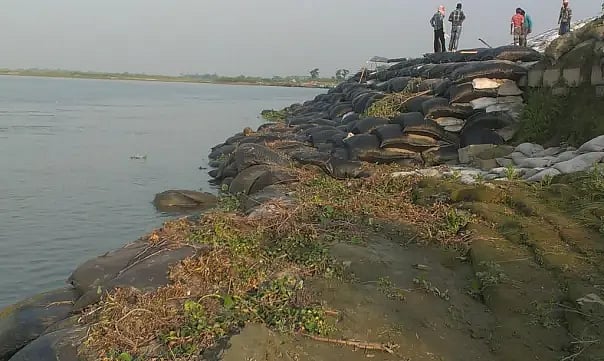 Who owns the encroached land near Dibrugarh’s old embankment?