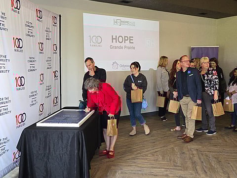 Providers and partners of the Hope Grande Prairie Network sign the declaration of participation.