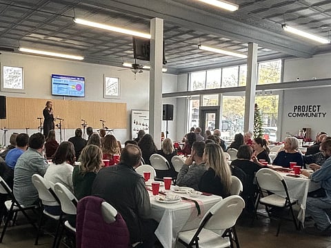 Kerry Bewley, the 100 Families Alliance Coordinator for Johnson and Franklin Counties speaking at the Partner Appreciation Luncheon