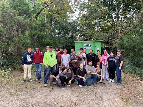 Jaimi Matlock, SJDCI Court Coordinator, and Preston Wallace, Bald Knob City Ordinance Officer, Jimmy Holland, a former participant of the Smart Justice District Court Initiative who is now employed as a Recovery Representative for Life in Victory, as well as other volunteers from both Smart Justice and Life in Victory.