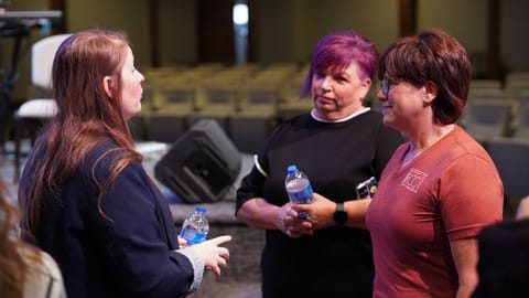 Morgan Warbington of the governor's Office of Faith-Based Initiatives talks to partners in the community