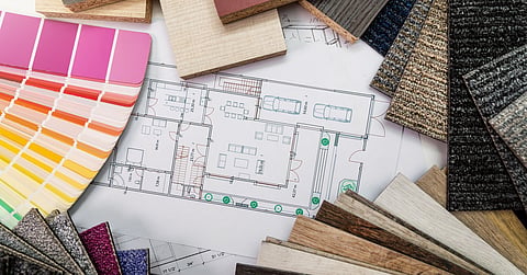  Assorted material samples including wood, fabric, and color swatches arranged around architectural floor plan.