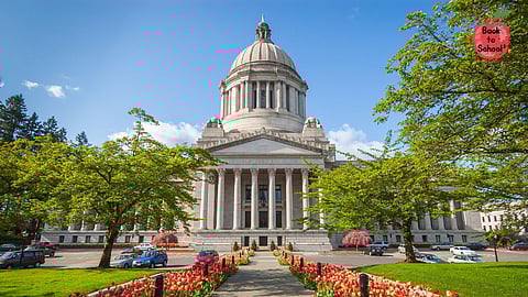 The Washington State Capitol building in Olympia, featuring a grand dome and neoclassical architecture, stands in the background. A landscaped pathway lined with blooming red and yellow tulips leads to the building's entrance, surrounded by green trees and parked cars. A red "Back to School" logo is visible in the top right corner.