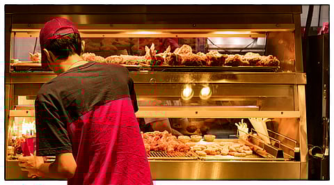Minimum Wage Employee at a Fast food Restaurant Kitchen.