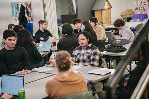 Young people from Seattle’s South End sit at tables discussing housing, safety, and education during a student listening session at Othello Commons hosted by local civic groups.