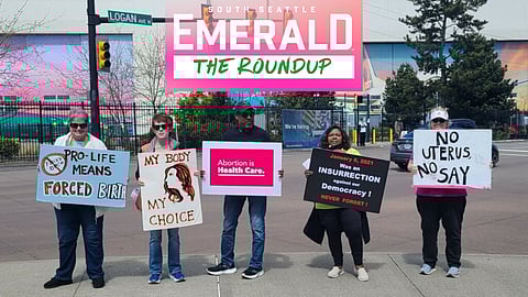 A Renton Rights Rally on reproductive rights in April 2024. Five people stand side by side holding signs in support of reproductive rights and democracy.
