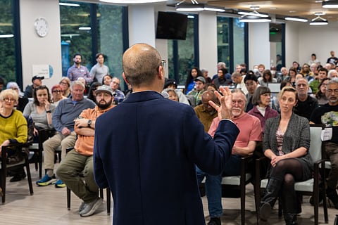 Seattle City Councilmember Eddie Lin speaks to a full house at an April 22 public safety town hall in North Beacon Hill.