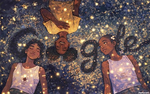 Three Black girls lie on their backs in a circle, heads together, smiling and relaxed under glowing golden lights on a dark blue ground. Their braided and curly hairstyles fan out around them.