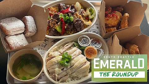 A tray full of various dishes from Mangosteen's Chicken Shop.