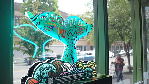A FIFA World Cup promotional display stands in the window of a Seattle business on Capitol Hill.