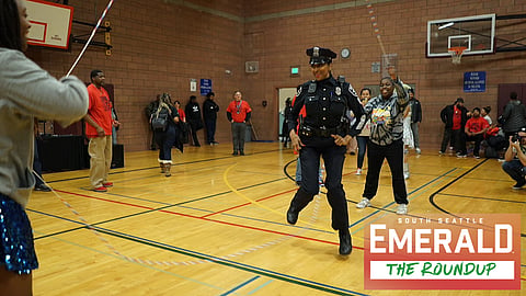 tective Denise "Cookie" Bouldin jumps rope in the middle of a gymnasium floor. She is wearing her uniform and hat.