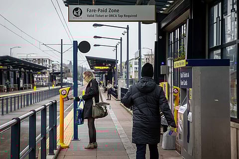 A rider taps their ORCA card at the Columbia City light rail station. (Photo: Lizz Giordano)