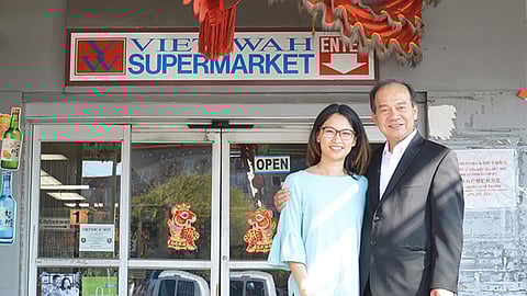 Leeching Tran (left), vice president of the Viet-Wah Supermarket, with her father Duc Tran (right), founder of the business, on Oct. 3, three days after the store's last day. (Photo by Chetanya Robinson, courtesy of the International Examiner)