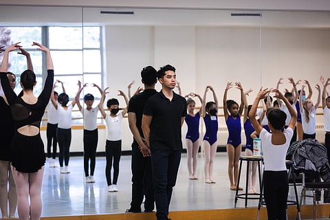 Pacific Northwest Ballet School faculty member Eric Hipolito Jr. with DanceChance students. (Photo: Lindsay Thomas)