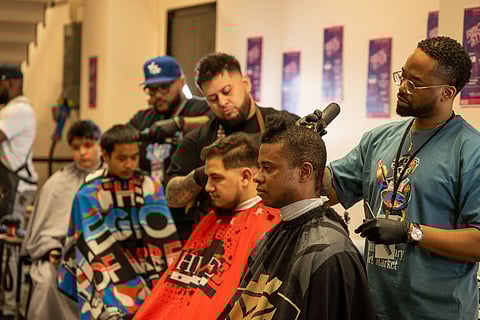 Barbers doing what they do during the "Watch Me Work" segment of the 10th Reign of Style Hair Show and Competition, March 3, at the Seattle Center Exhibition Hall. (Photo: Susan Fried)