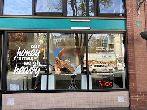 A poem by Joe Nasta on the window at Slide Gallery. Nasta and other local poets have their poems on display at various locations around Seattle as part of the public poetry project by Shin Yu Pai, Civic Poet of The City of Seattle. (Photo: Shin Yu Pai)