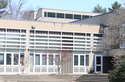 The exterior of a 1970s school building. 