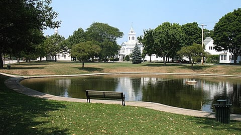 Cohasset, Massachusetts town common; duck pond in foreground; First Parish church left background, Second Congregational church center background