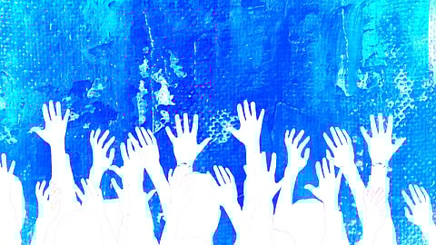 blue splatter painted background with white silhouettes of hands raised 