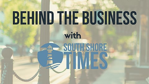A blurry shot of Main Street with the text "Behind the Business with South Shore Times" overlaid. 