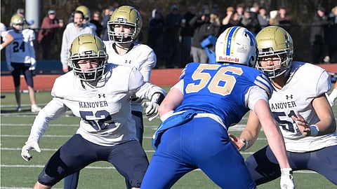 Norwell and Hanover football players face off on the gridiron. 