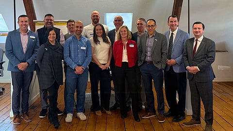 a group of people stand in an office