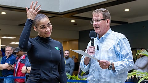 Hale at Granite Telecommunications' "Saving by Shaving" charity event alongside Governor Maura Healey. 