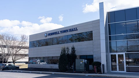 Norwell Town Hall, a white building with large windows.