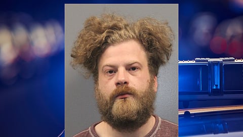 A mug shot of a white man. 