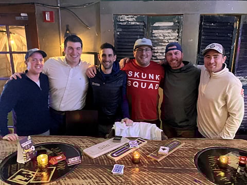 League members gather weekly at a local pub, where friendly competition turns into meaningful connection and community.