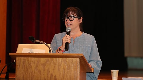 Then-school committee chair Michelle Ayer speaks at Hingham Public Schools' 2022 convocation. Ayer has served on the school committee for nine years and will depart when her term expires in May.