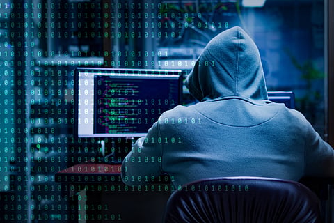a hacker at a computer