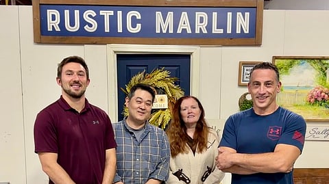 A photo of four team members