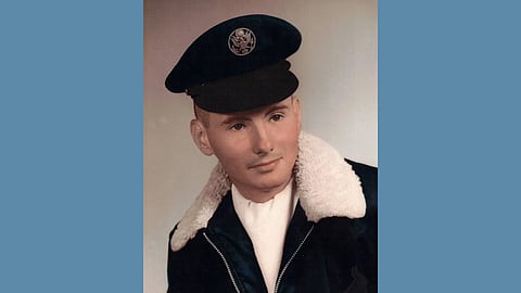 Vintage photo of a young white airman wearing a jacket with lambswool collar and a military hat
