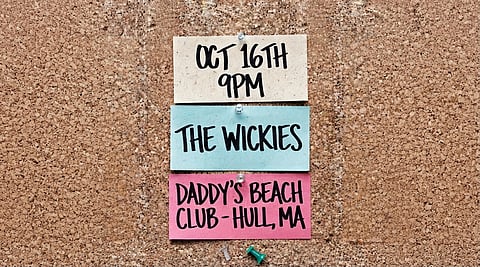 promo poster for the wicks with notes on a bulletin board