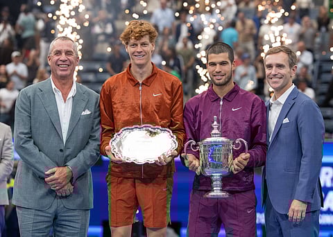 Jannik Sinner and Carlos Alcaraz pose with silverware along with Ivan Lendl (L) and USTA President Brian Vahaly 