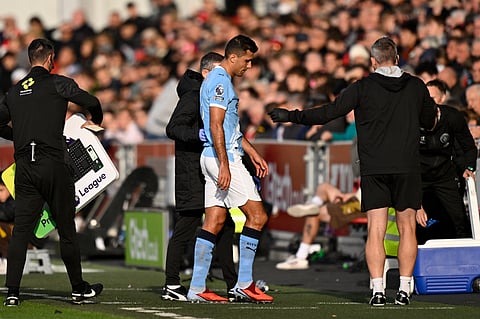 Rodri walks away from the pitch after suffering an injury in the game against Brentford 