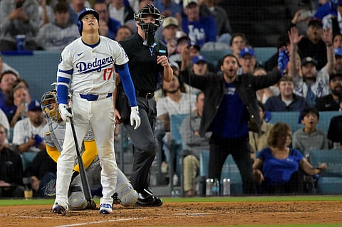 Shohei Ohtani reacts after hitting his second home run for Los Angeles Dodgers in the MLB Playoffs