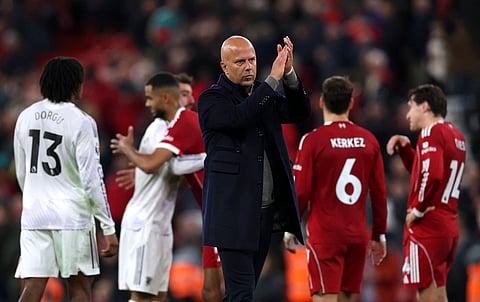 Liverpool manager Arne Slot applauds the fans after the loss against Manchester United