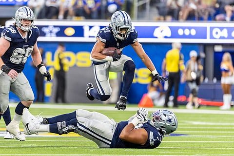 Dallas Cowboys cornerback Caelen Carson leaps in the air in an NFL match