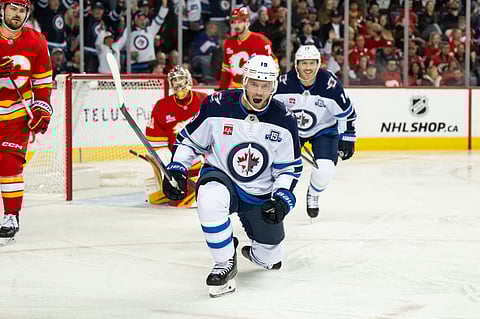 Jonathan Toews celebrates after scoring for Winnipeg Jets