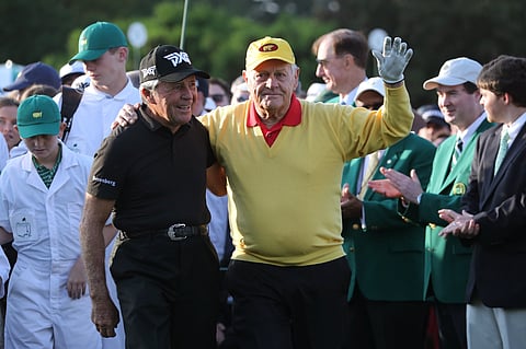 Honorary starters Jack Nicklaus of the U.S. and Gary Player of South Africa (L) arrive for the ceremonial start on the first day of play at the 2019 Master golf tournament