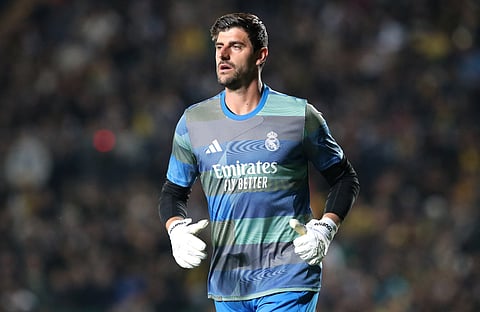 Real Madrid goalkeeper Thibaut Courtois warming up before a UEFA Champions League match 